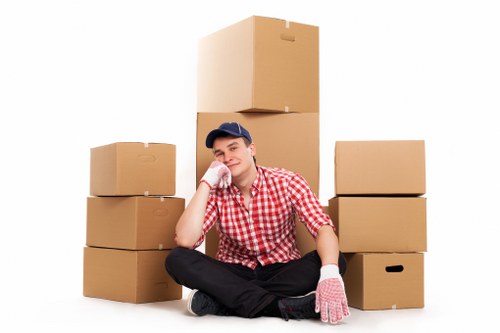 Packed household boxes and furniture ready for loading